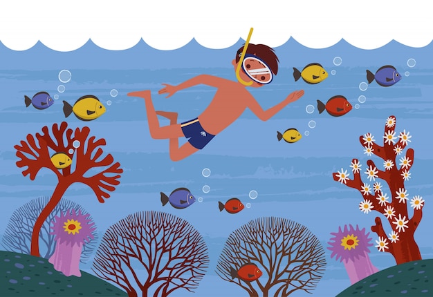 健康な魚とサンゴの周りのきれいな海で泳いでいる少年