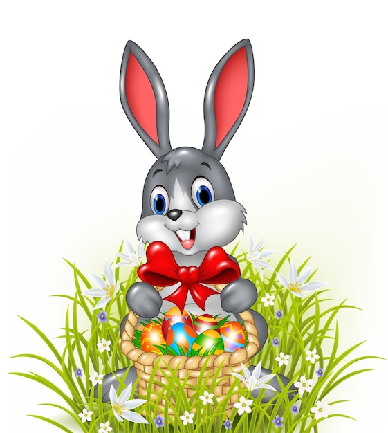 Пасхальный кролик с корзиной расписных пасхальных яиц