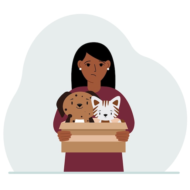 女性が猫と犬と一緒に段ボール箱を持っている 救助の助けとペットの世話の概念