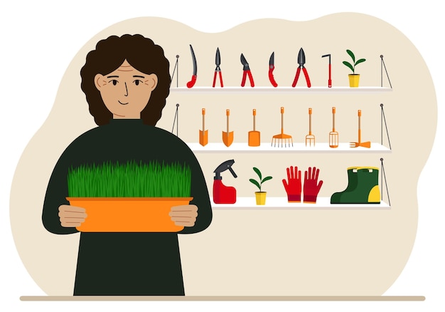 한 여성이 원예 도구의 배경에 대해 손에 식물을 들고 있습니다. 원예 개념