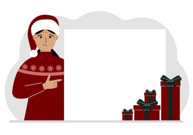 赤いサナ帽をかぶったクリスマスまたは新年のセーターを着た女性が、空白のポスターまたはテキスト用のスペースのある大きな白い紙のバナーを指で指しています
