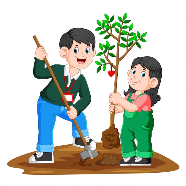 若い父親と娘が木を植える