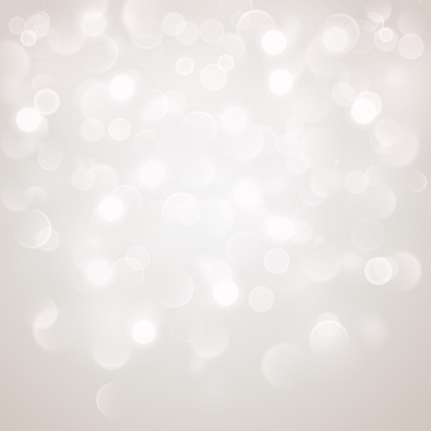 Abstract background with bokeh effect Blurred defocused lights in white colors White bokeh lights on gray background