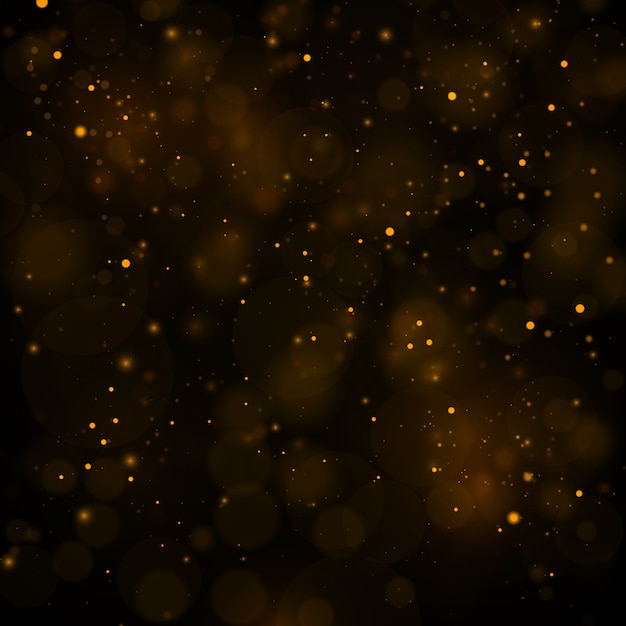 Abstract background with gold bokeh effect, dust particles.