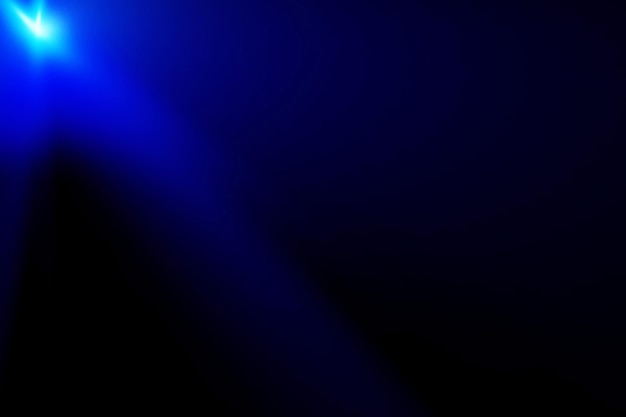 Abstract blue light beam in darkness