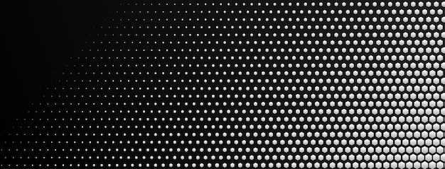 Abstract halftone background made of small hexagonal dots of different sizes in white and black colors