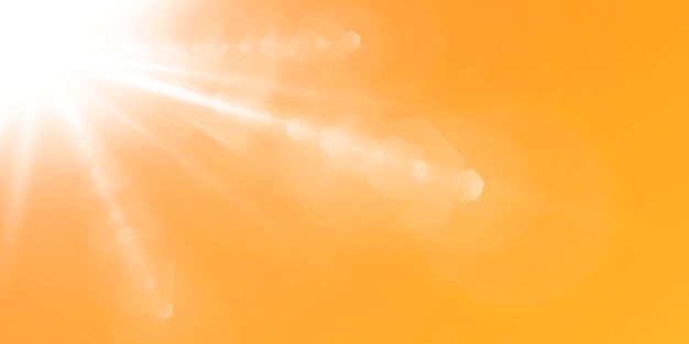 Abstract sparkling lens flare with sparkling sun on a yellow and orange background. a warm sun that is filled with natural rays of light glare.  isolated  .