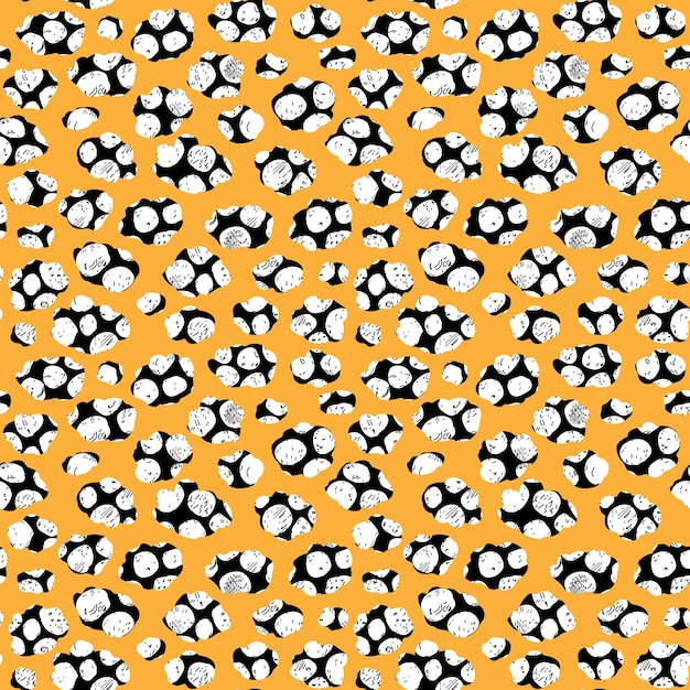 Abstract spotted pattern Vector seamless pattern on orange background