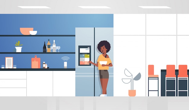 Vector african american woman touching refrigerator screen with smart speaker voice recognition