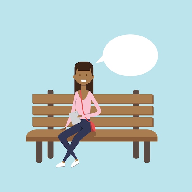 Vector african woman using tablet sitting wooden bench chat bubble female character full length on blue background flat