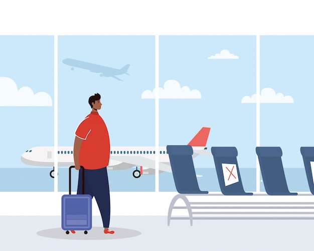 Afro young man with suitcase in airport