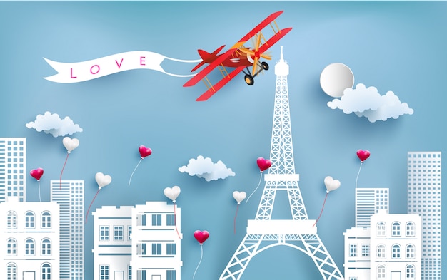 aircraft carrying love banners flying over the city and eiffel towers.