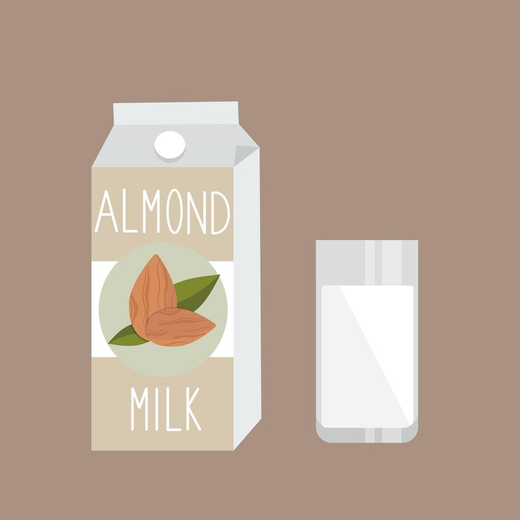 Almond milk on carton pack and glass on beige