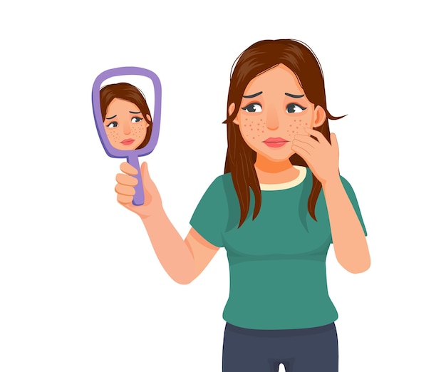 anxious young woman holding mirror looking at acne spot pimples on her face