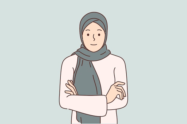 ヒジャブを着たアラブ人女性が腕を組んで立ち、ファッションの概念の多様性について画面を見ている
