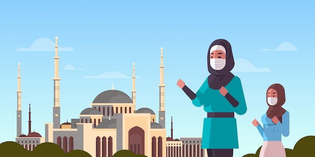 Молитва арабских женщин в масках рамадан карим священный месяц коронавирус пандемия карантин концепция