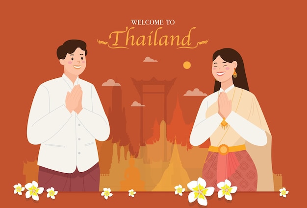 Азиатские тайцы, одетые в традиционные платья, приветственно звонят савасди или вас со смайликом. тайская культура дружелюбно приветствует знаменитое место.