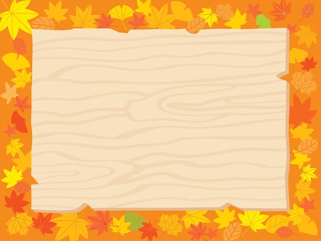 Осенние опавшие листья и деревянная доска объявлений.