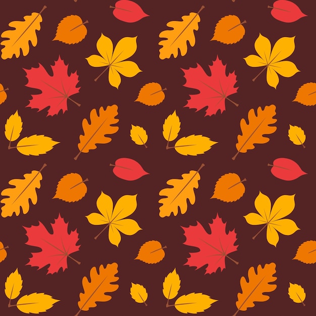 Осенний бесшовный узор с желтыми и красными листьями на коричневом фоне