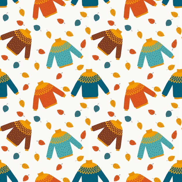 Autumnal seamless pattern with colorful sweaters and leaves in flat style