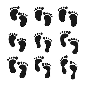 Impronte di bambini. piedi umani in piedi per terra. isolato su sfondo bianco.