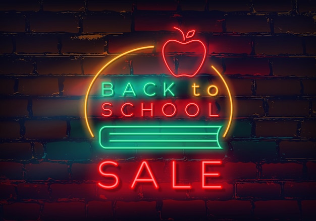 Insegna al neon di ritorno a scuola sullo sfondo del muro di mattoni in vendita e sconto