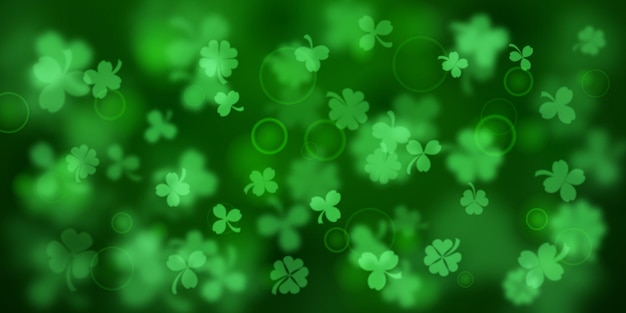 Background on St Patrick's Day made of blurry clover leaves in green colors