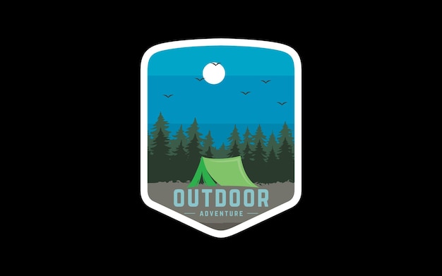 A badge with a green tent and trees on it