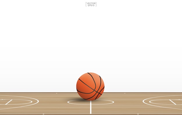 Basketball ball on wooden court.