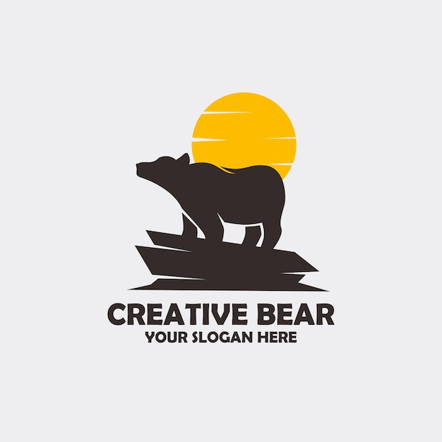 A bear standing on a rock logo