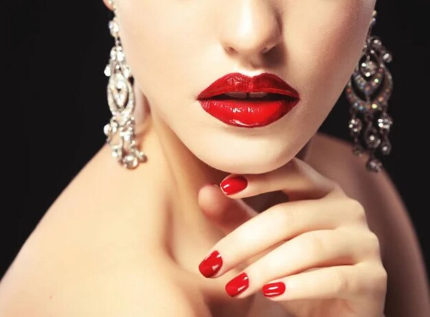 Beautiful lips close up Red lipstick Black background