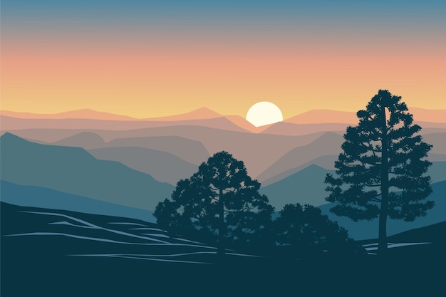 Beautiful misty sunset over mountains with trees in silhouette