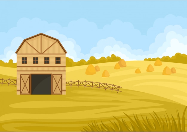 Beige barn with an open gate to the field with a haystack.