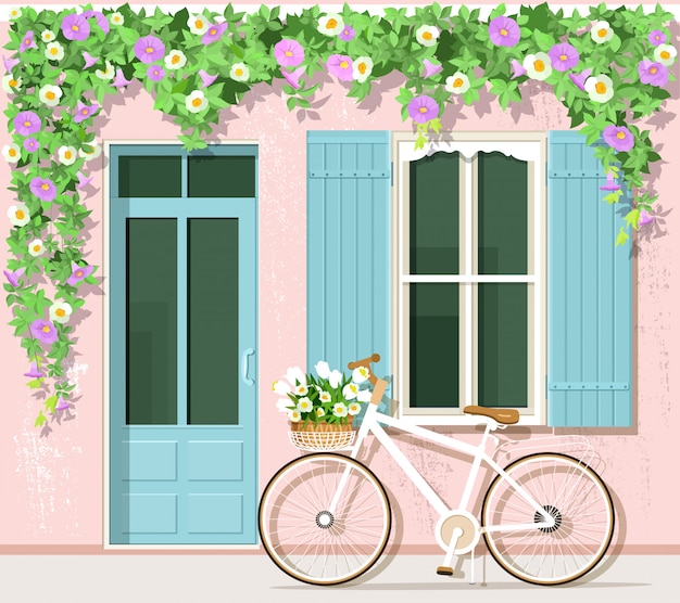 Vettore bicicletta con fiori vicino alla casa in stile provenzale