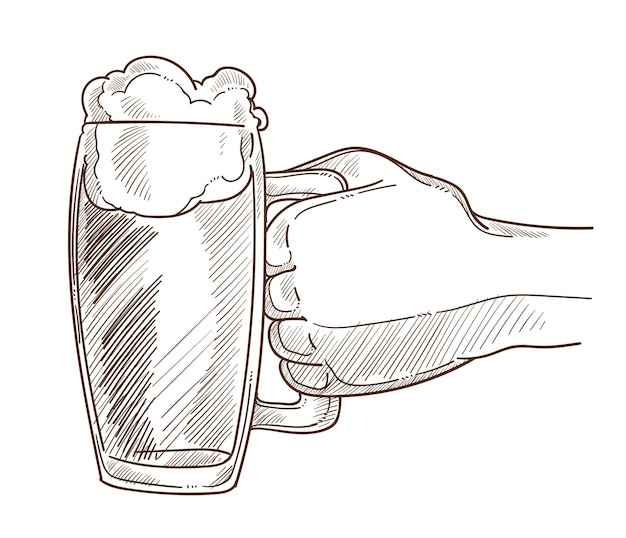 big mug of bear with foam in male hand