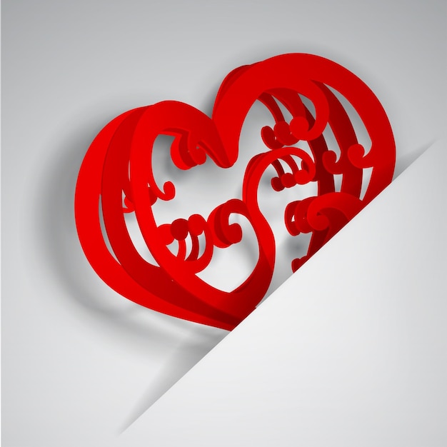 Grande cuore rosso con riccioli inseriti in un ritaglio in un foglio di carta bianca