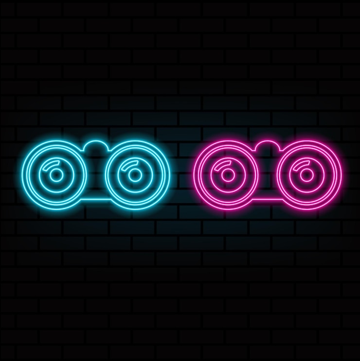 Vector binoculars explore multicolor neon icon on dark brick wall
