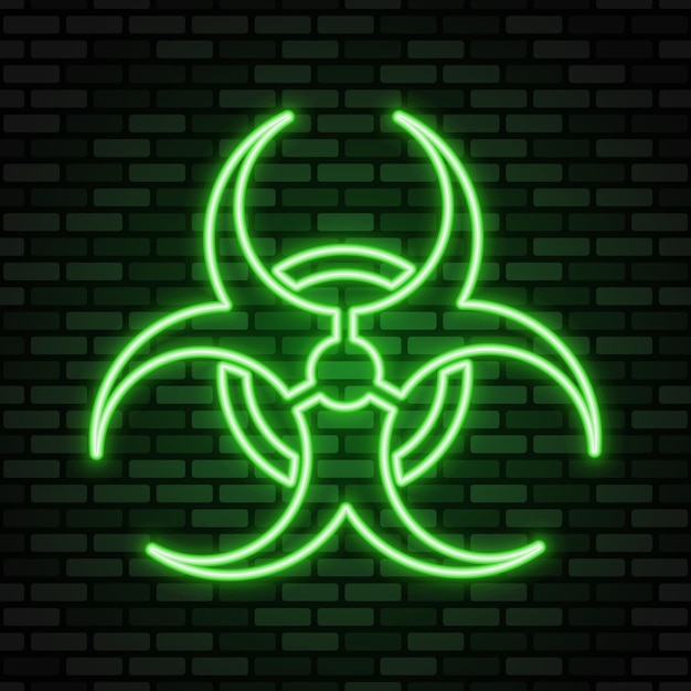 Неоновая икона биологической опасности. Зеленая неоновая вывеска на темной кирпичной стене.