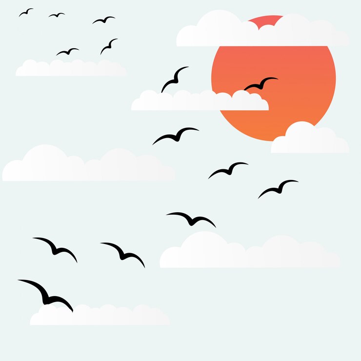 日没時に鳥が飛ぶ