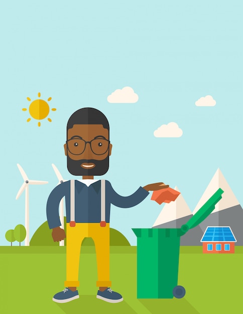 Black man throwing paper in a garbage bin.