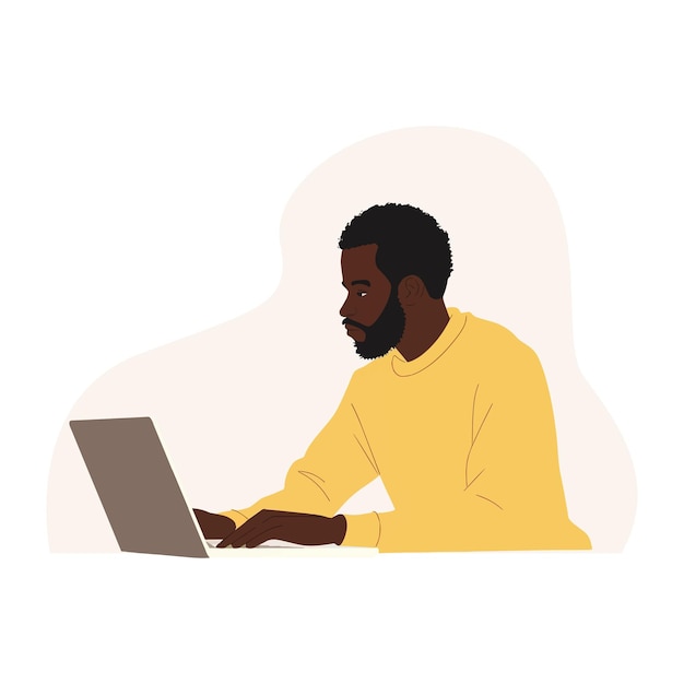 Black man using laptop on beige background