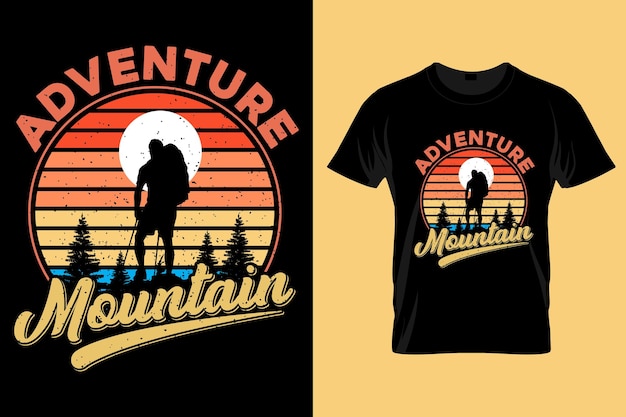 A black t - shirt with an adventure mountain on it