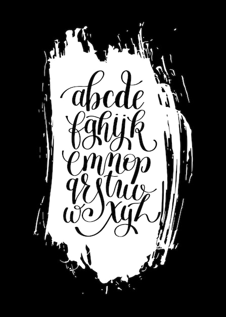 Black and white hand lettering alphabet design on brush stroke spot pattern handwritten