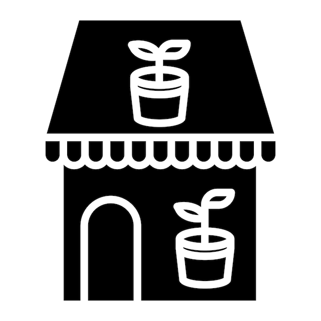 A black and white image of a house with a plant on it