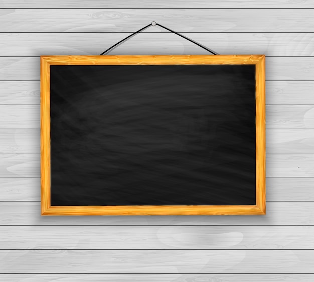 Vector blackboard on wooden background vector