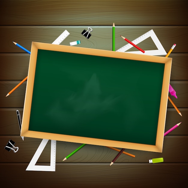 Blank black board on wooden background