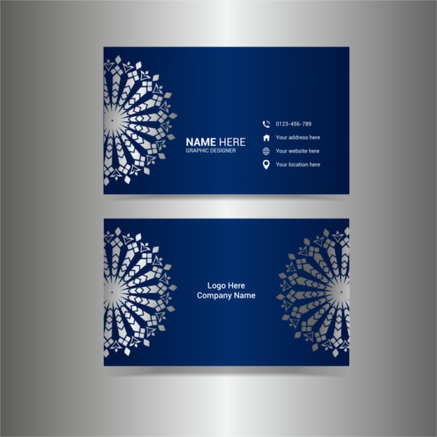 A blue business card with a logo for a company called ". "