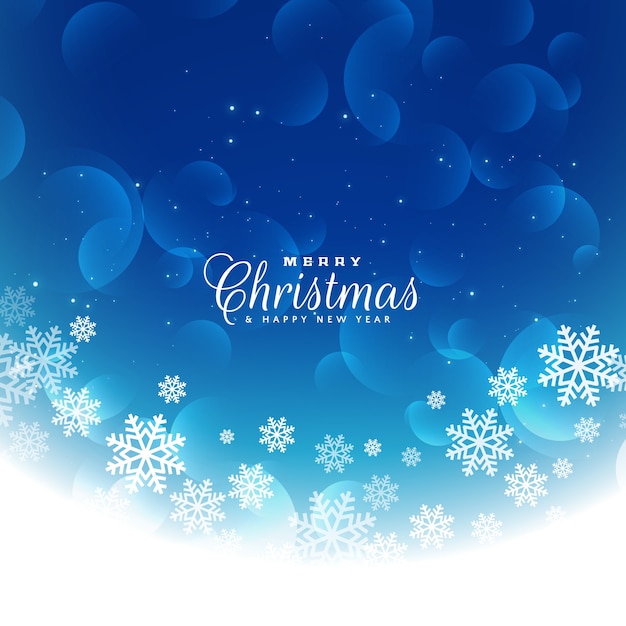 青いクリスマスの背景と雪片
