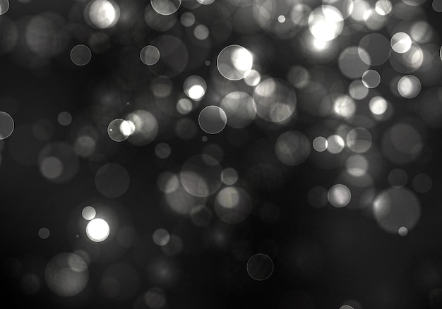 Luce offuscata del bokeh su fondo nero. scintillio d'argento astratto sfocato stelle lampeggianti e scintille.