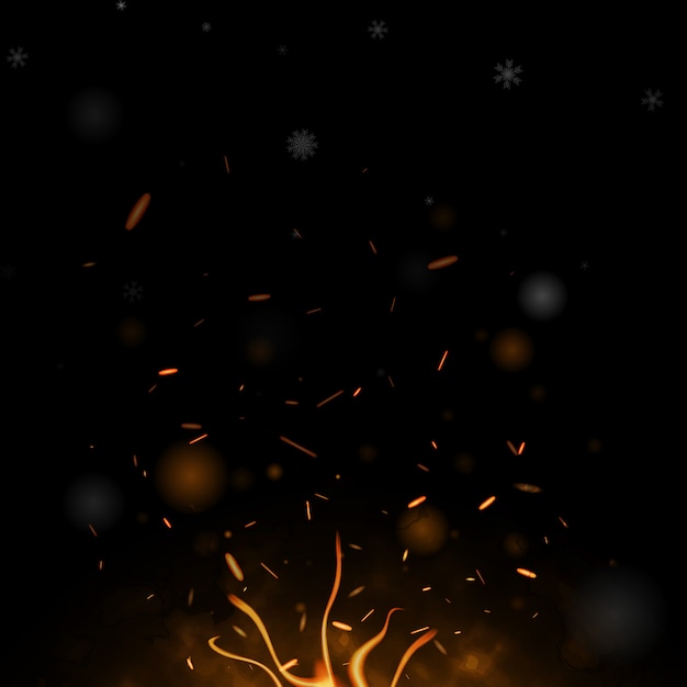 Bonfire, burning sparks flying towards snowflakes.